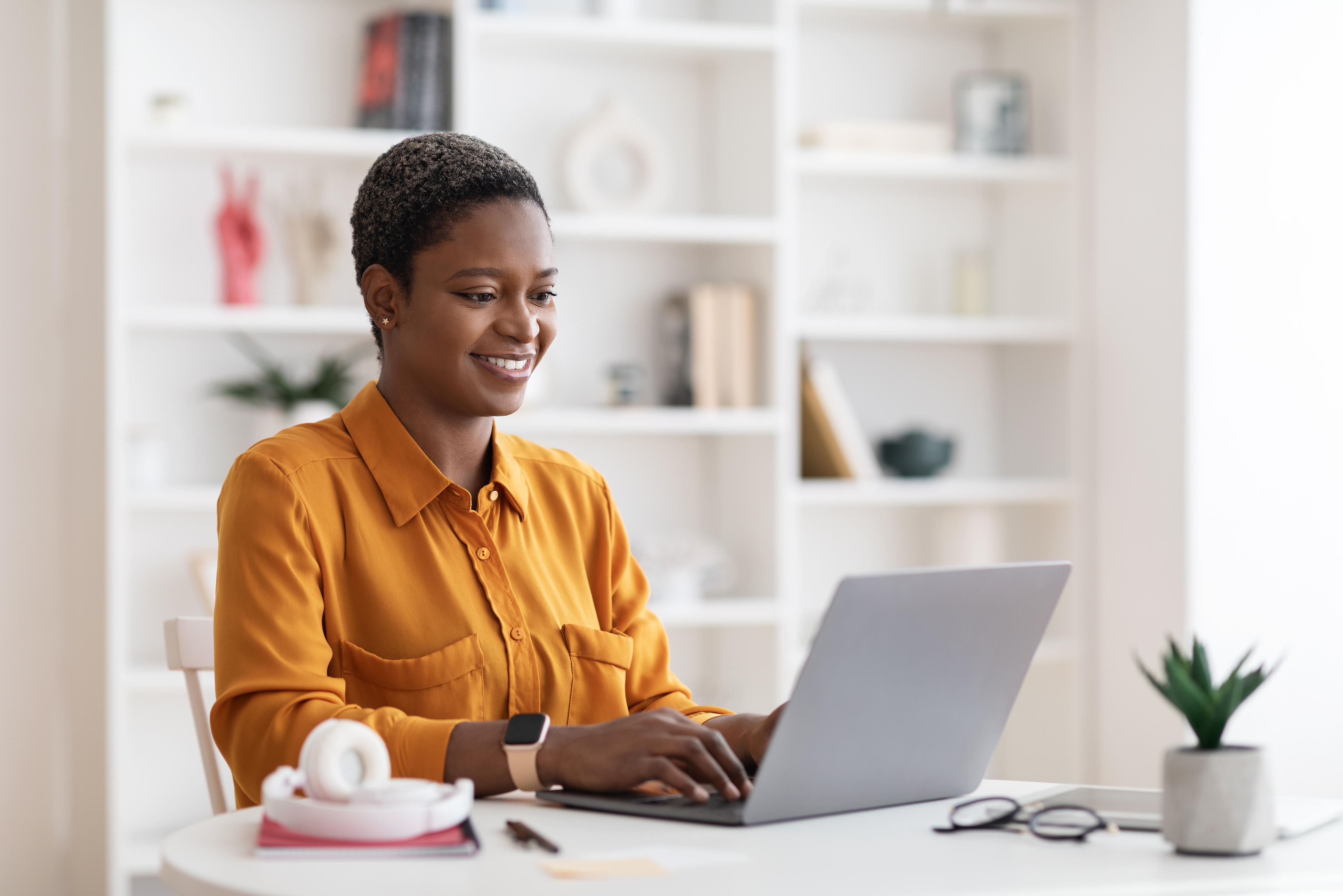 Woman Typing on Laptop