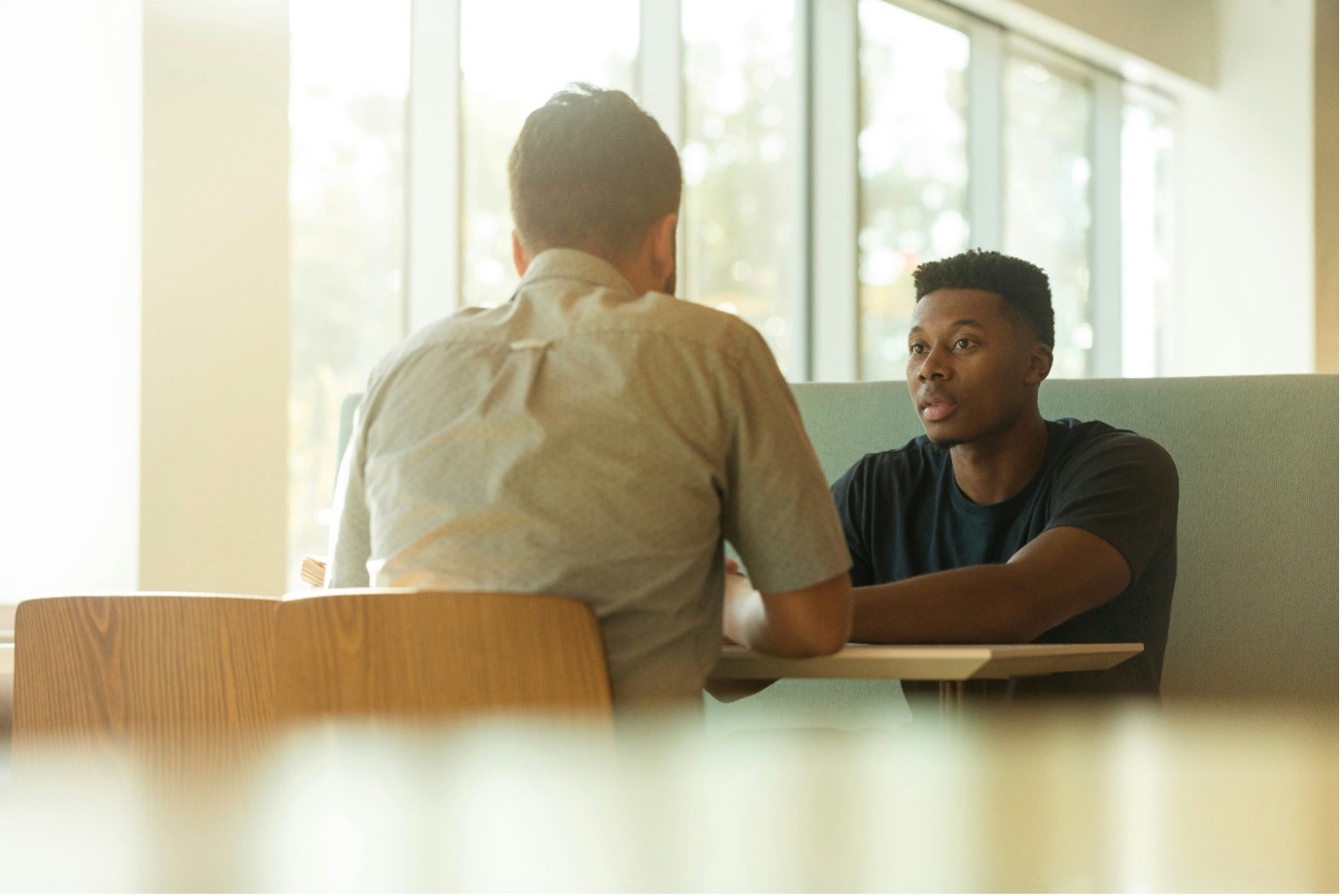Therapists Speaking over a Table