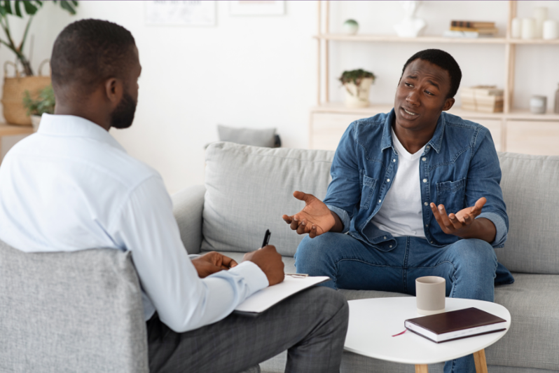 therapist talking to patient